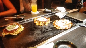 Okonomiyaki being made at the table!